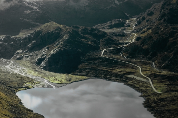 Aerial view of Susten Pass with mountain lake reflecting the clouds, Swiss Alps, 2224m